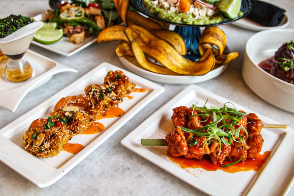 Stop in for a bar bite like these pictured. Signature happy hour pairings include the Oilman (prime burger + an old-fashioned cocktail $25) and the Uptown Girl (their voila! Vodka cocktail made with framboise and pineapple + blue crab guacamole, $25). (Photo by Photos courtesy of Truluck's)