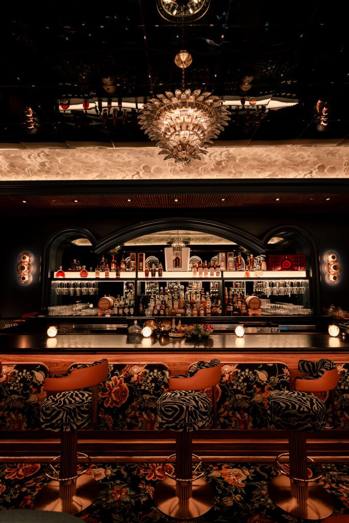 The Casa Brasa space features an open-fire grill, raw bar and sushi counter, private event spaces, and an energetic bar.