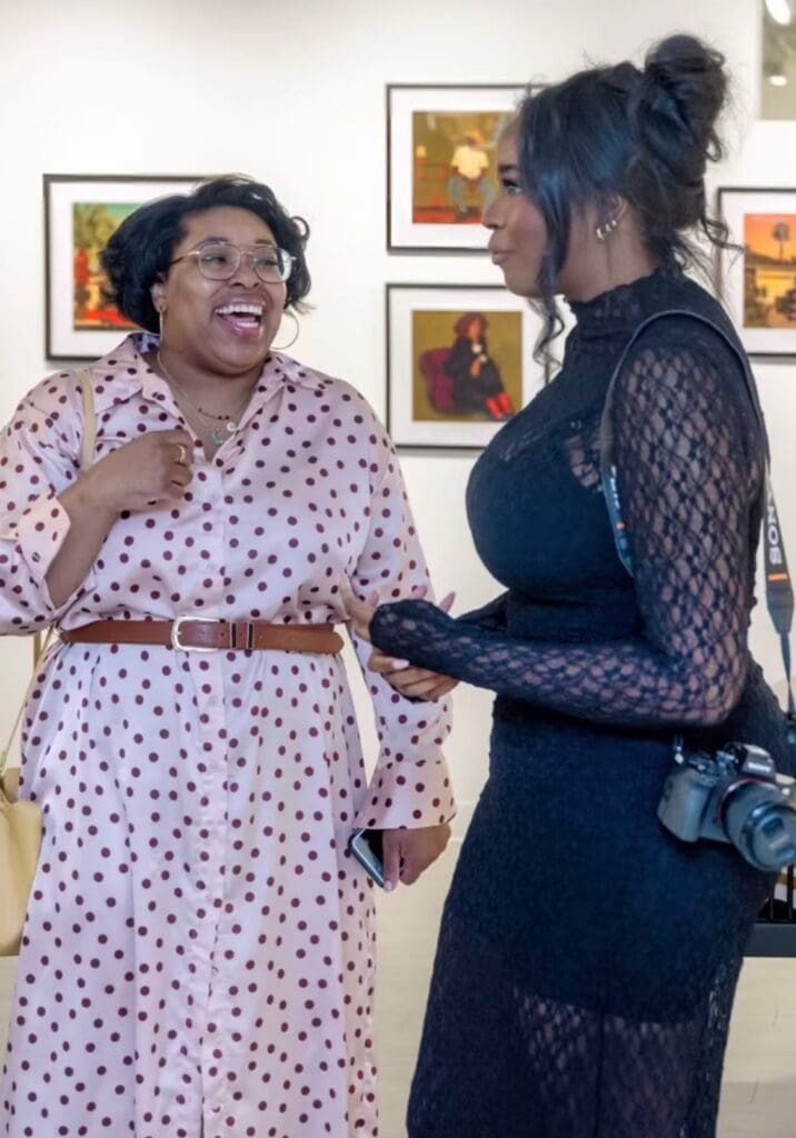 Dev'n Goodman chats with artist Tatyana Alanis. (Photo by Walt Burns)