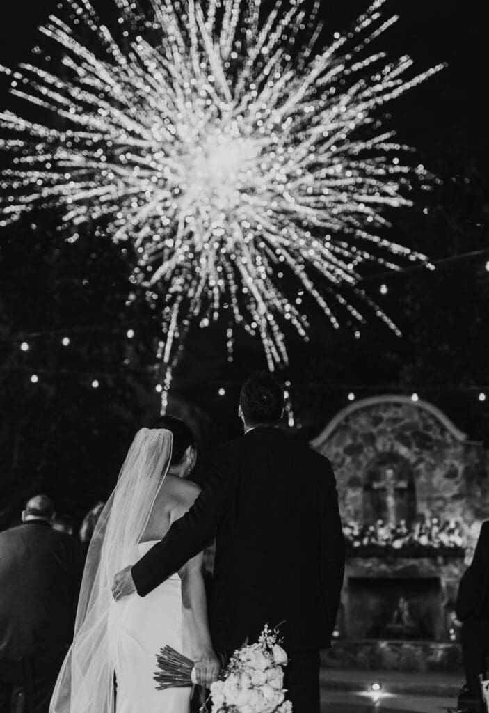 The couple's first kiss was the perfect moment for fireworks, provided by ROAR over Texas. (Photo by Martin Hernandez Photography)