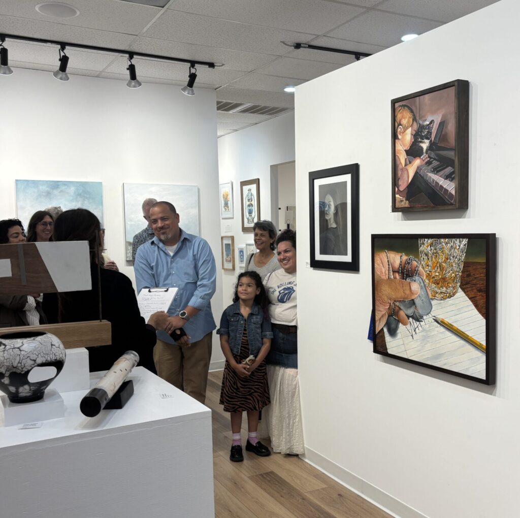 Guest juror Gabriella Monterroso announced Jason Turner as her first-place selection at the opening reception for “Modern Mirrors.” (Photo by Laura Landsbaum)