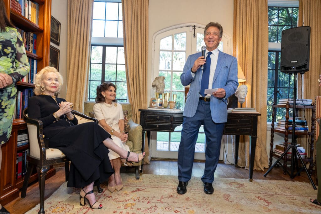 Steve Wyatt gives remembrances of his mother, Lynn Wyatt, in honor of the book in her name, Linda McReynolds (Photo by Jenny Antill)