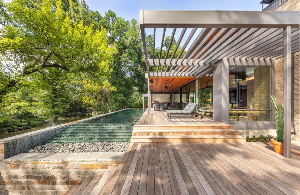 At North Janmar Drive, a natural slope to a creek requires the back of the home and pool to be elevated. (Photo by Terri Glanger)