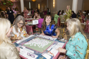 Rebecca Mendal smiles big as Mahj for Meals kicks off (Photo by Sharon Ellman, Ellman Photography)