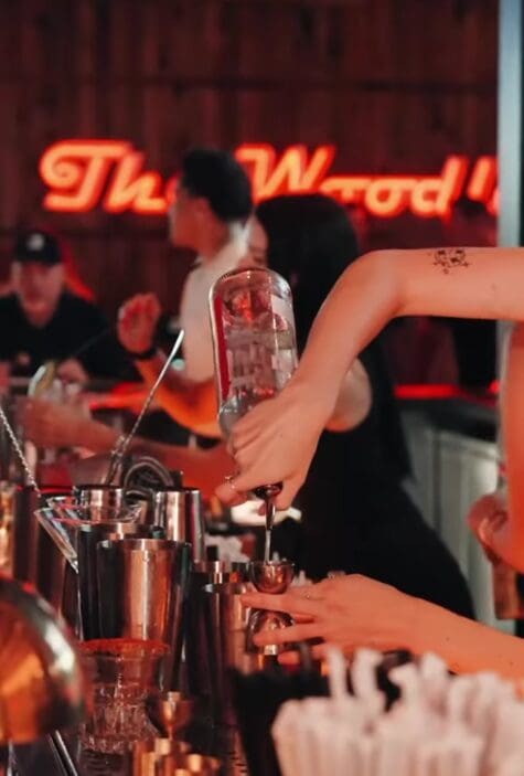 Bartenders mix cocktails at Local Public Eatery’s lively bar in The Woodlands. (Photo courtesy Local Public Eatery)