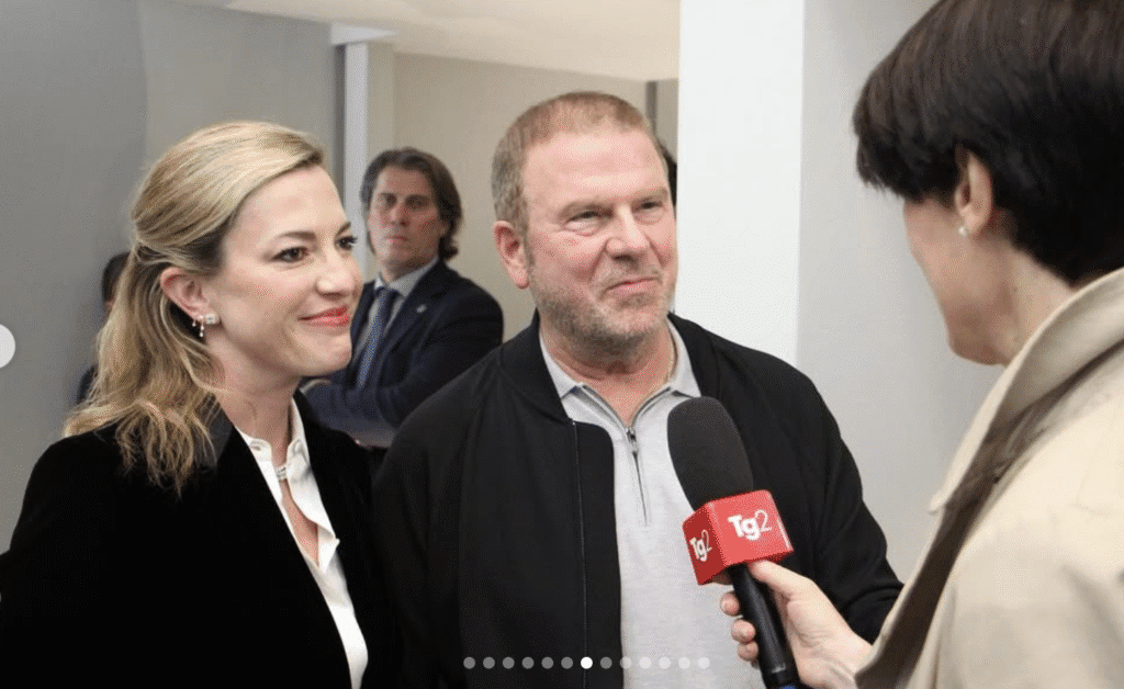 U.S. Ambassador to Italy Tilman Fertitta and wife Lauren interviewed by Italian television during Milan fashion week. (Photo by Instagram)