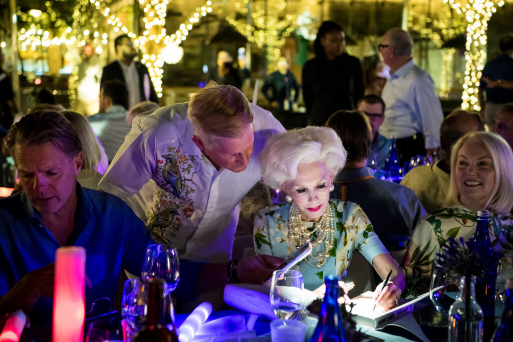 Sheila Grant autographing her book, "Passport to Danger" (Photo by Tamytha Cameron)