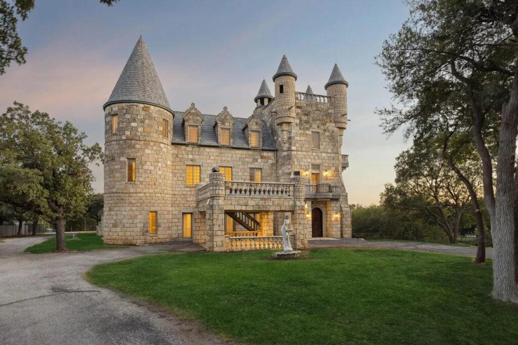 Perched above the shoreline of Eagle Mountain Lake, the stone manor commands more than three acres of wooded waterfront, offering panoramic views that merge Scottish-inspired architecture with North Texas scenery. (Courtesy)