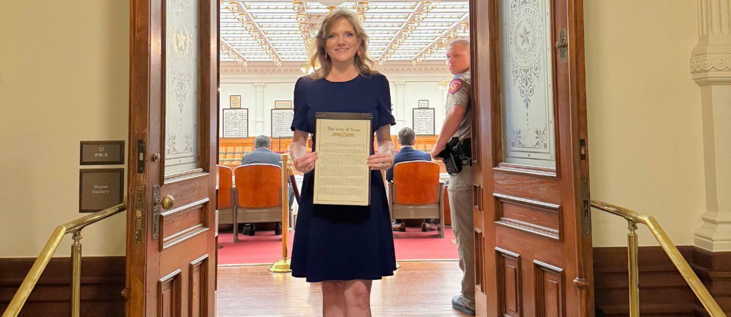 Alecia with Award at Texas Congress (Courtesy Alecia Lawyer)