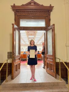 Alecia with Award at Texas Congress (Courtesy Alecia Lawyer)