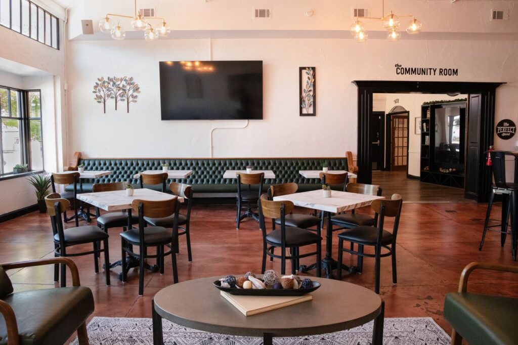 The bright, welcoming Community Room at Bread & Better Life Café on West Magnolia Avenue hosts free daily workshops on mindfulness, wellness, and relationships. (Courtesy Bread & Better)