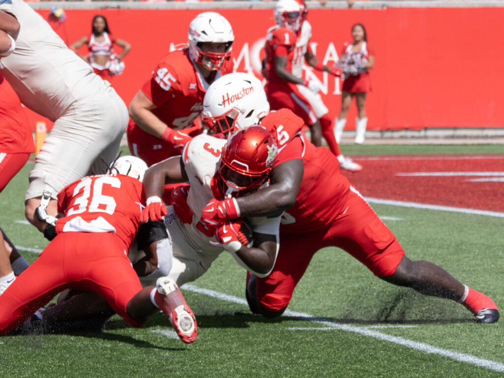 University of Houston's defense is hard hitting with Carlos Allen (No. 5) often leading the way.  (Photo by F. Carter Smith)