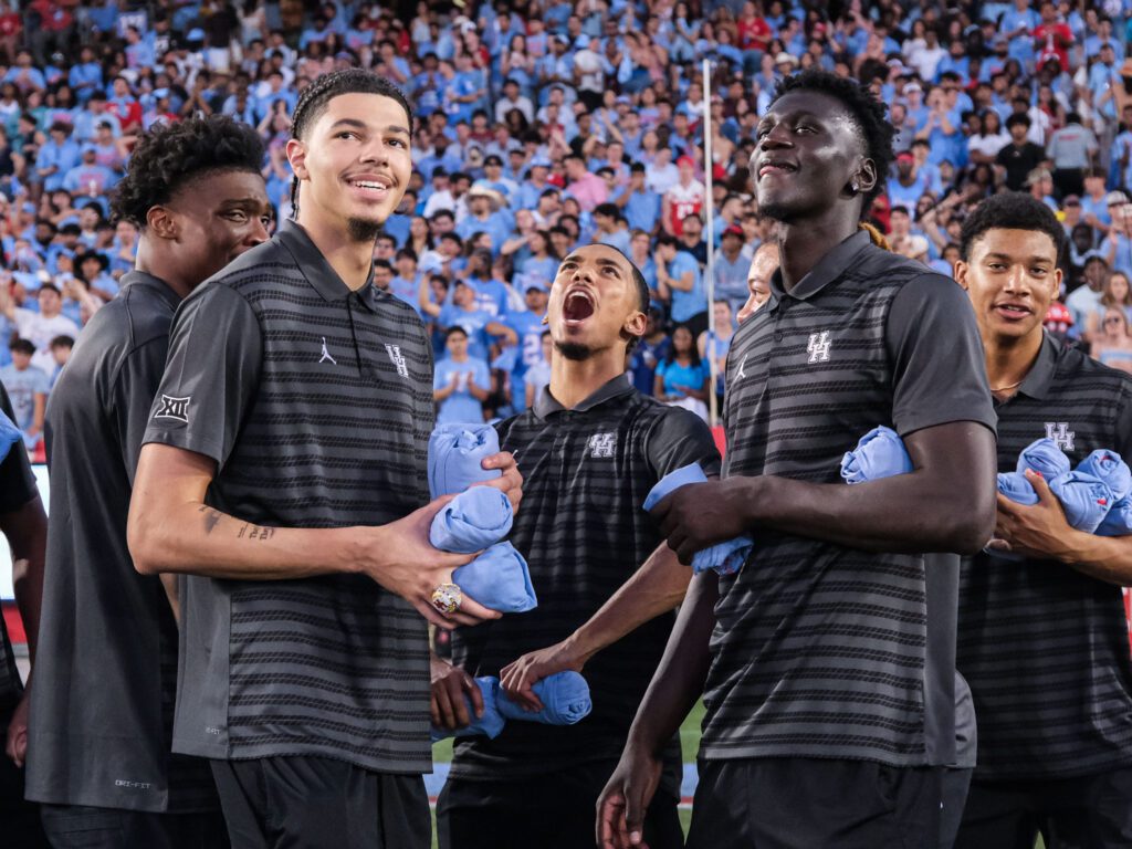 University of Houston basketball players Cedric Lath, Jacob McFarland, Milos Uzan, Kalifa Sakho and Bryce Jackson enjoy a championship worthy celebration. (Photo by F. Carter Smith)