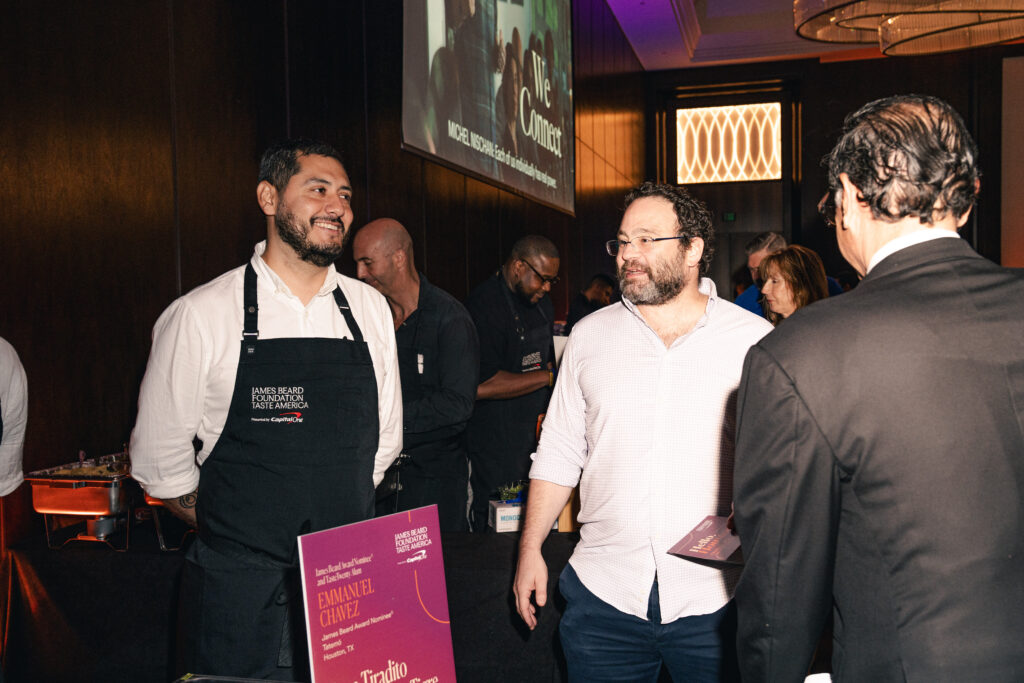 Chef Emmanuel Chavez (left) mingles with Houston foodies at James Beard Foundation's Taste America: Houston event. (Photo by Michael Anthony)
