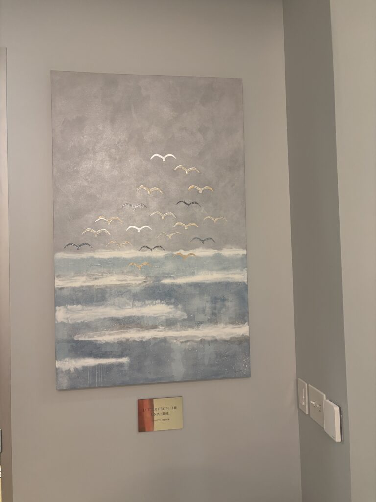 Annette Palmer's art contains snippets of antique love letters in the birds. (Photo by Laura Landsbaum)