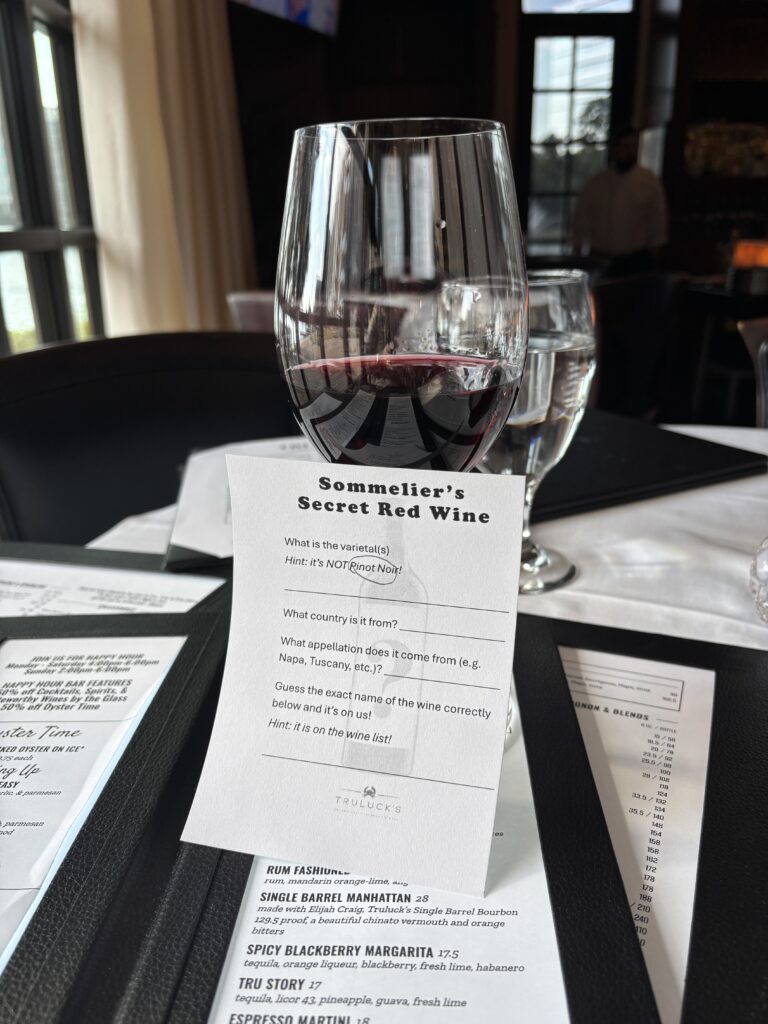 Guests can put their palates to the test with Truluck’s Sommelier’s Secret Red Wine Challenge, where each glass holds a mystery waiting to be guessed through October 31. (Photo by Laura Landsbaum)
