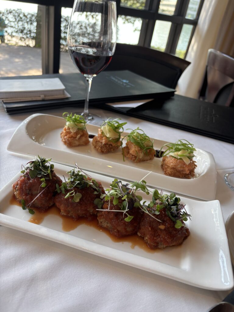 Truluck’s happy hour tempts guests with USDA Prime meatballs and spicy salmon crispy rice among its standout specials. (Photo by Laura Landsbaum)