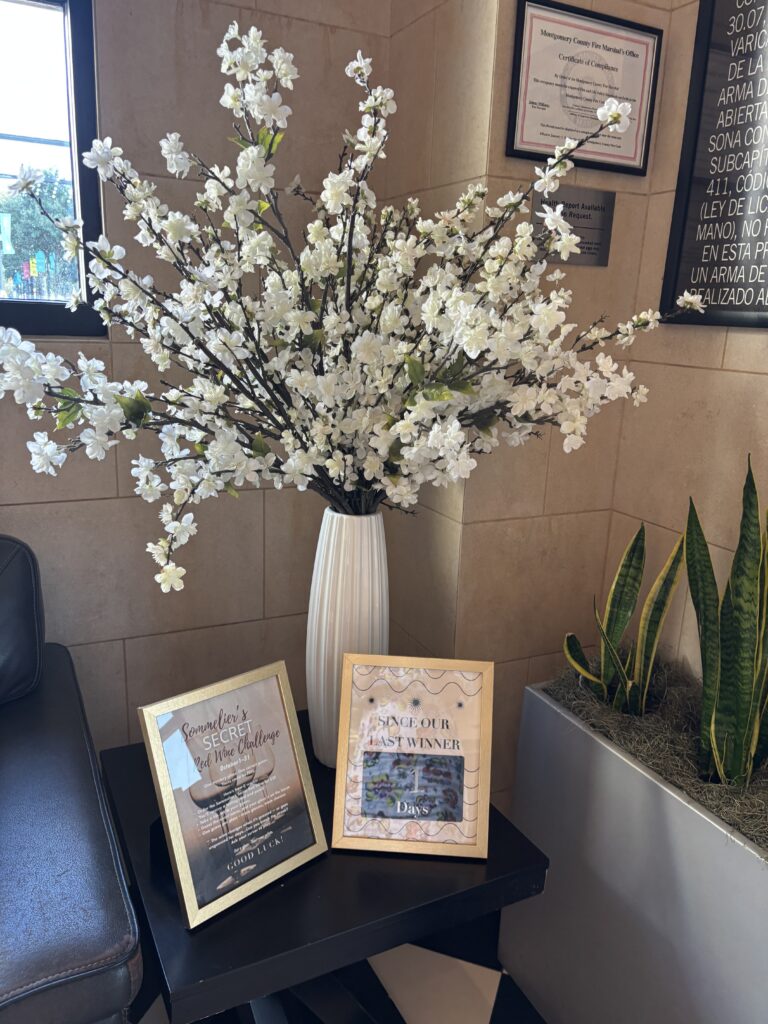 The Mystery Wine Challenge rules greet guests at the entrance, where a chalkboard keeps count of how many days the secret has remained unsolved. (Photo by Laura Landsbaum)