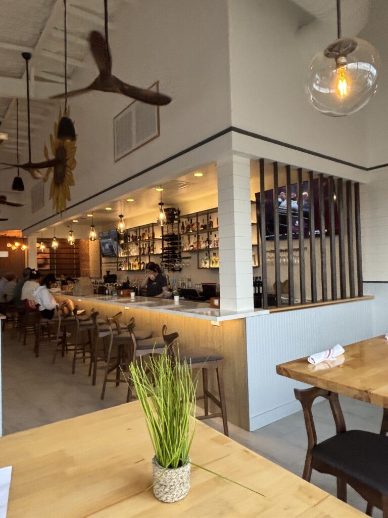 The bar at d'Alba has seating, and is open to the indoor dining area. (Photo by Laura Landsbaum)