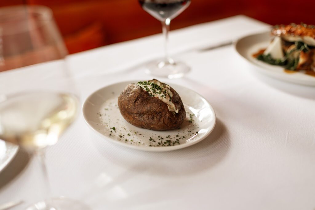 Chef Wes Whitsell's loaded baked potato is a must-order at Georgie. (Photo by Beckley)