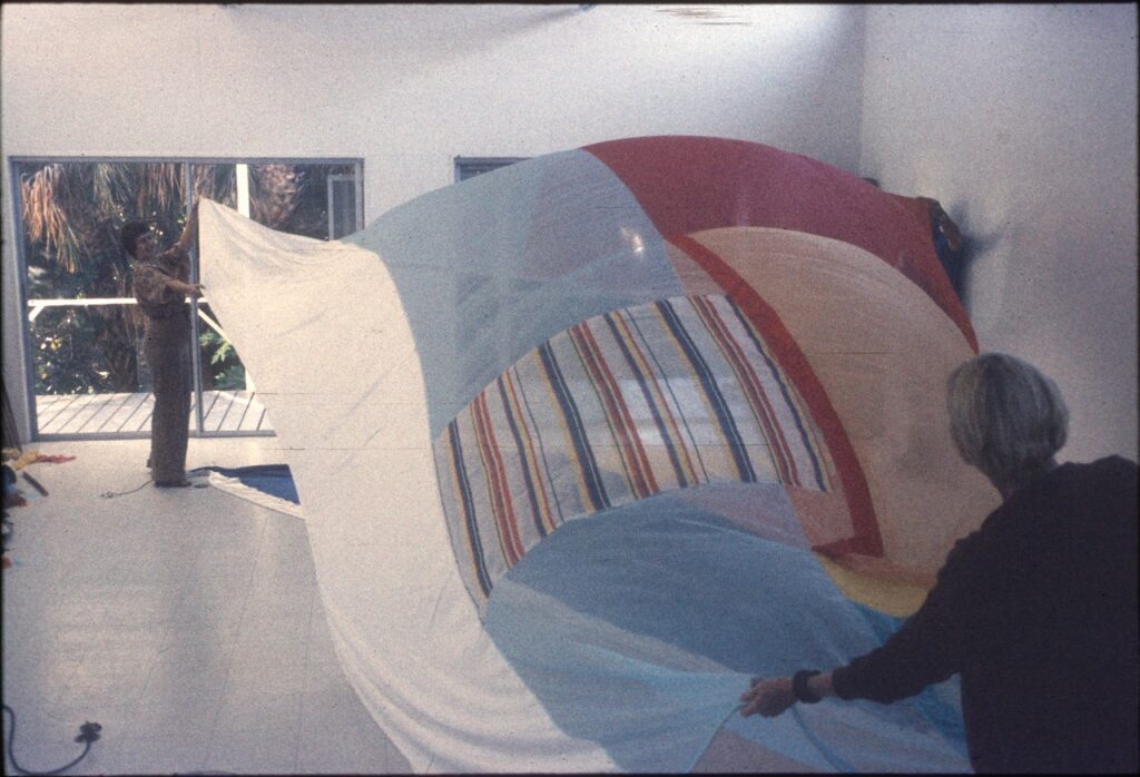 Studio assistants working on "Tantric Geography," Robert Rauschenberg's set and costumes for Merce Cunningham Dance Company's "Travelogue" (1977) in Rauschenberg's studio, Captiva, Florida, circa 1977. (Photo: Unattributed. Photograph Collection, Robert Rauschenberg Foundation Archives, New York)