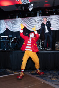 Ronald catches bid paddle during paddle drop – Daniel Ortiz