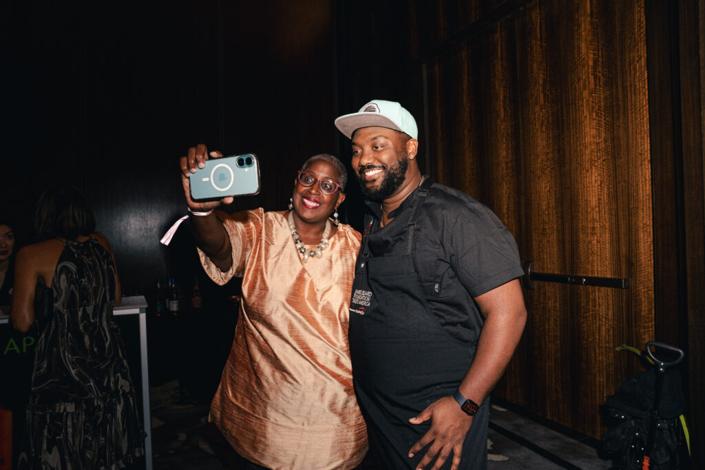 Chef Tristen Epps (right) with a guest at James Beard Foundation's Taste America: Houston (Photo by Michael Anthony)