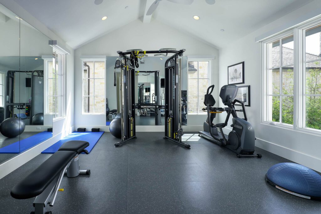 Upstairs, the home boasts four en-suite bedrooms, a spacious game room, a versatile bonus room or exercise space, and a second laundry room.