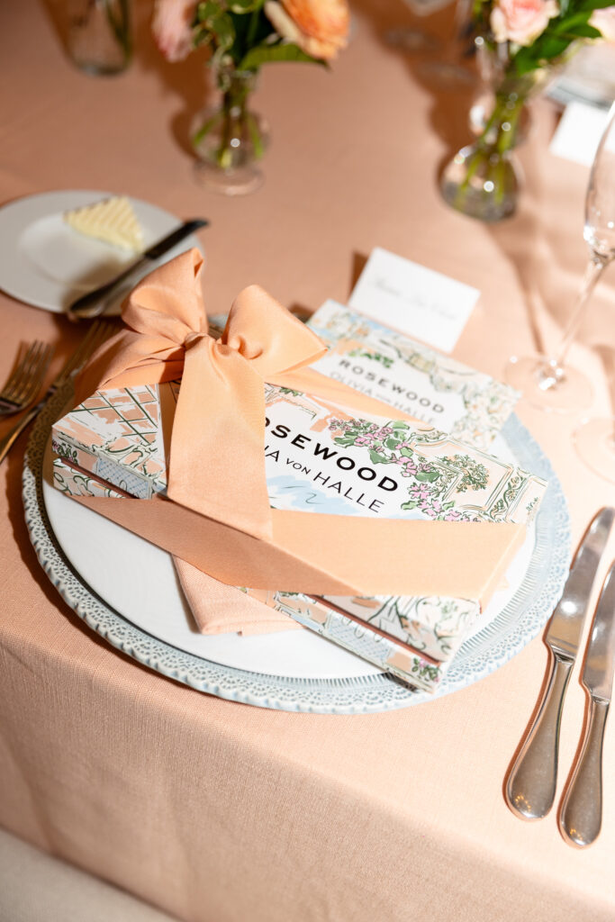 At each place setting, guests received the eye mask, elegantly wrapped in a peach bow. (Photo by Kaitlin Saragusa Kellerman)
