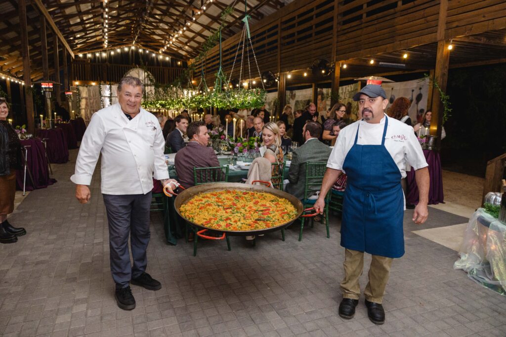 Chef Pedro Garcia presents paella at the 20th anniversary Delicious Alchemy banquet benefiting Recipe for Success Foundation (Photo by CatchLight Group)