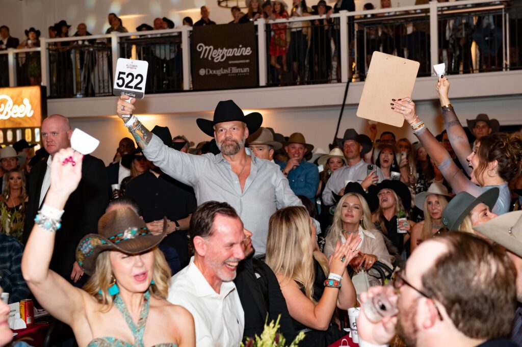 Chris Parvin bids in the live auction. (Photo by Tamytha Cameron)