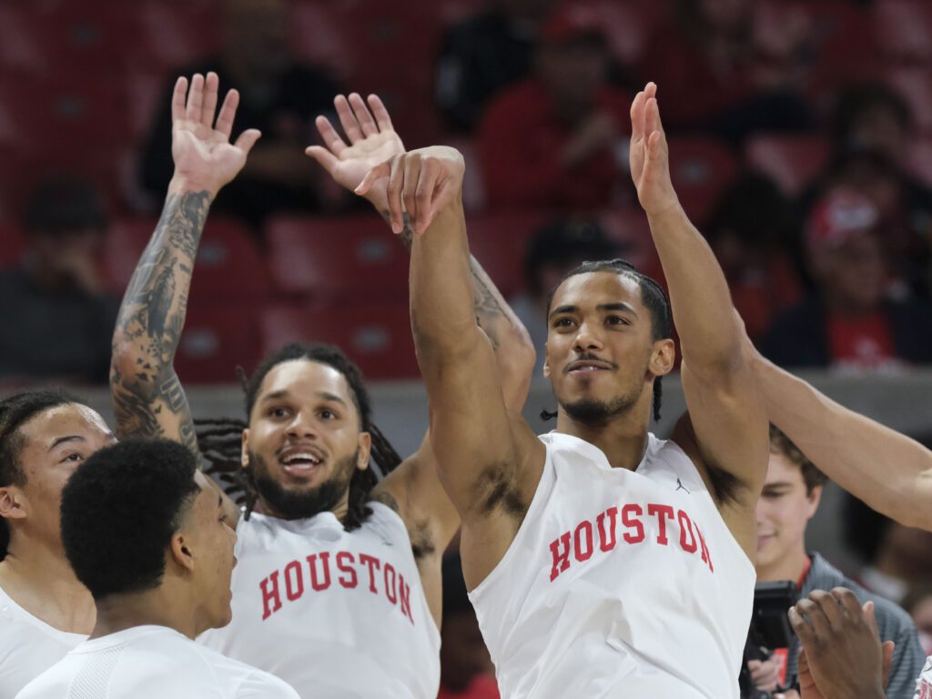 University of Houston guards Emanuel Sharp and Milos Uzan must deliver for Kelvin Sampson's team. (Photo by F. Carter Smith)