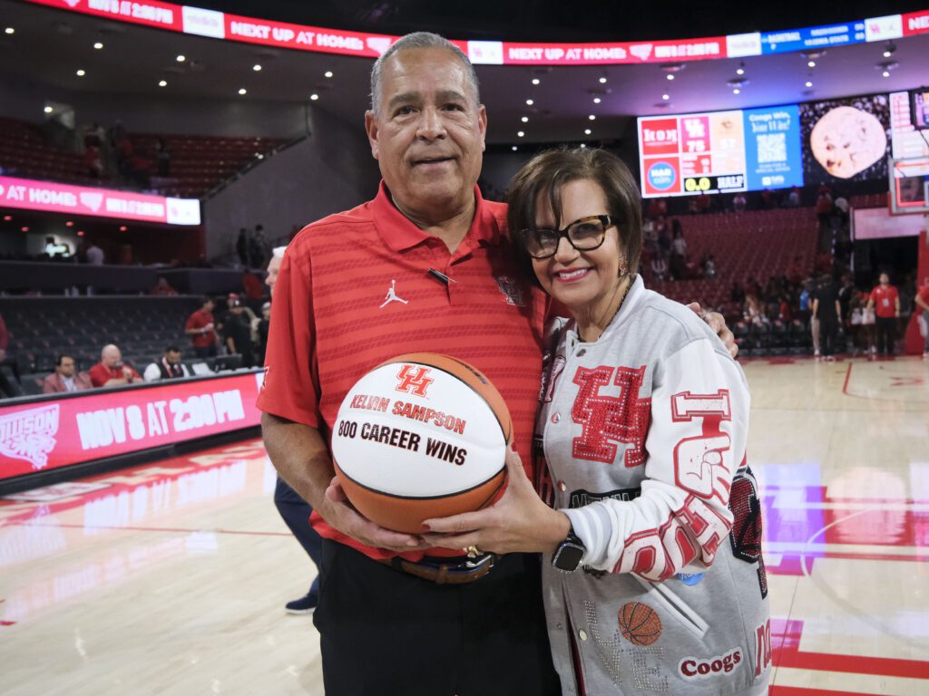 University of Houston coach Kelvin Sampson and his wife Karen embrace the 800th win ball. (Photo by F. Carter Smith)