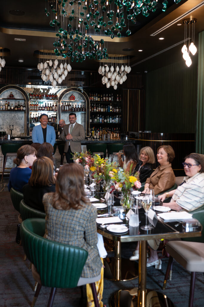 Chris Nguyen, Deleon Pinto welcome guests to The Bastion Collection luncheon. (Photo by Shane Dante)