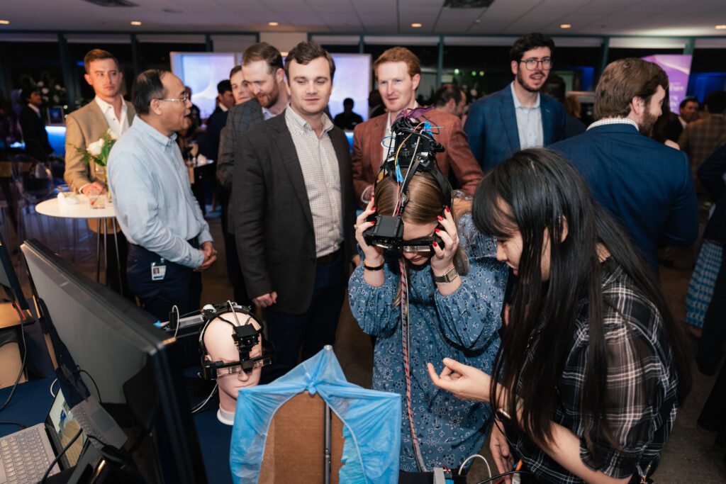 Guests line up to try UT Southwesterns Cancer Vision Googles at one of the innovation stations (Photo by Jay Simon)