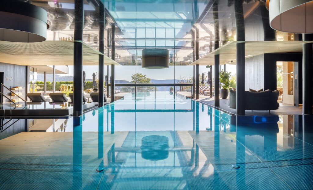 The resort’s infinity pools and sun terraces provide a front-row seat to the breathtaking landscapes that make the Dolomites one of Europe’s most spectacular regions.