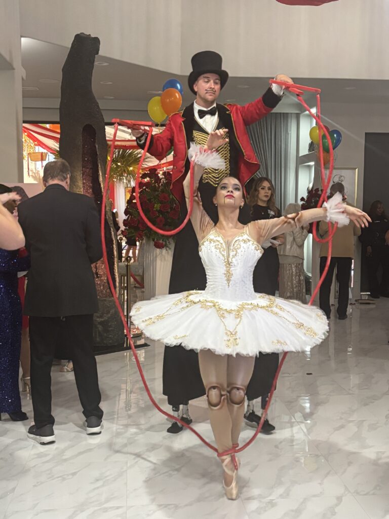 Stilt walkers and ballerinas moved among the crowd at Fashion Woodlands. (Photo by Laura Landsbaum)