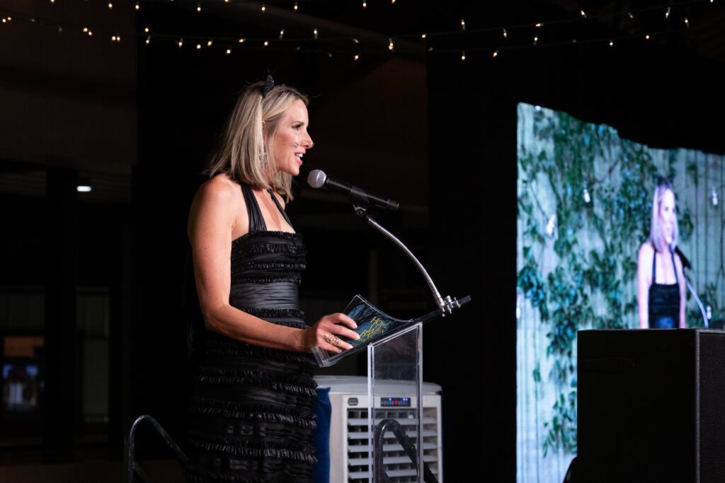 Ilona Carson addressing the crowd at Houston SPCA's 5th Annual Howl-O-Ween Ball (Photo by Wilson Parrish)