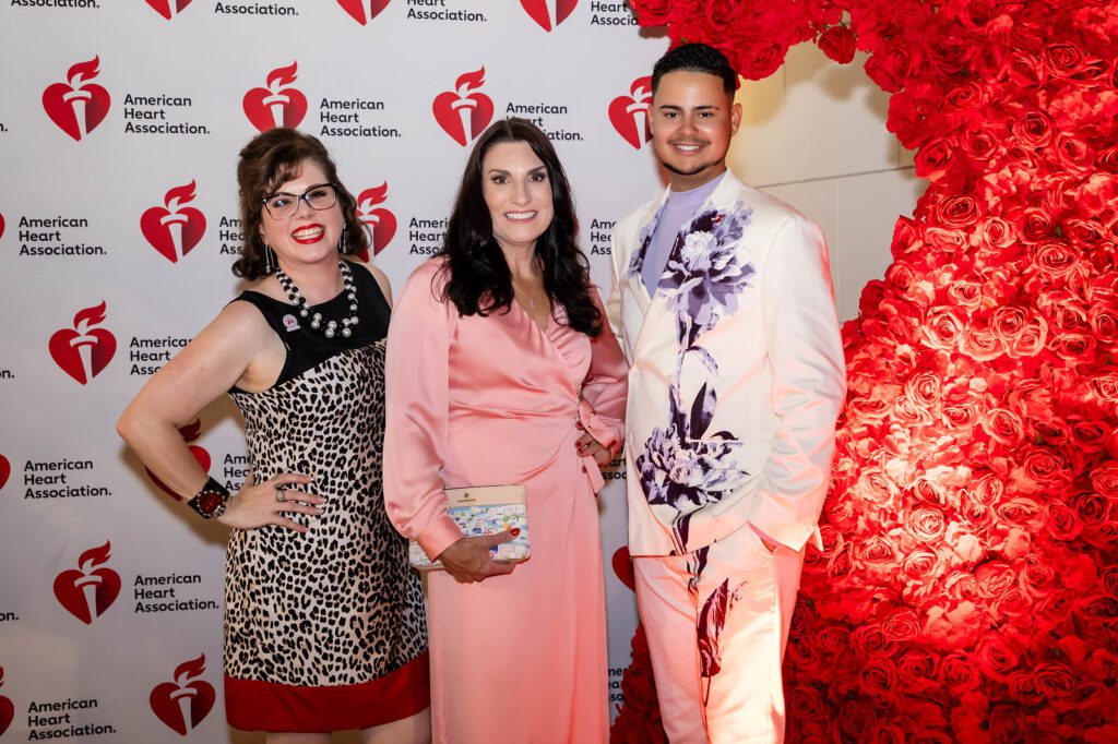 Melody Torno, emcee Cheryl Mercedes, Dion Bart at the Elizabeth Anthony 'Go Red for Women' fashion event (Photo by (Photography by Christina Griffin, WDR Imagery))