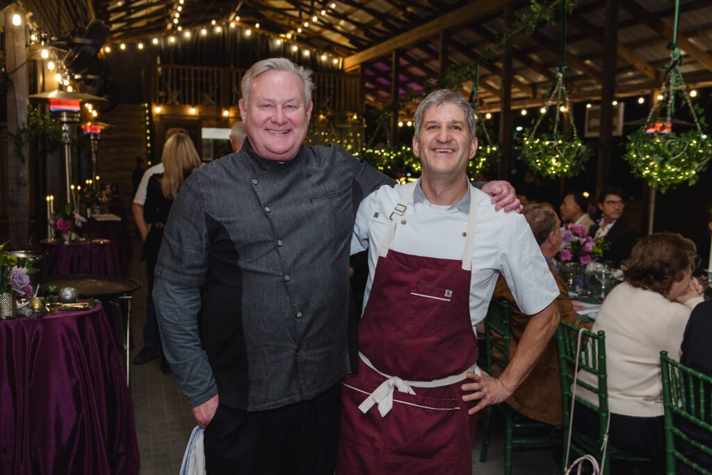 'OG' chefs Greg Martin, Ryan Pera working the 20th anniversary Delicious Alchemy banquet benefiting Recipe for Success Foundation (Photo by CatchLight Group)