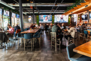 The interior of On the Kirb has plenty of giant screens visible from every seating location. (Photo courtesy of Becca Wright)