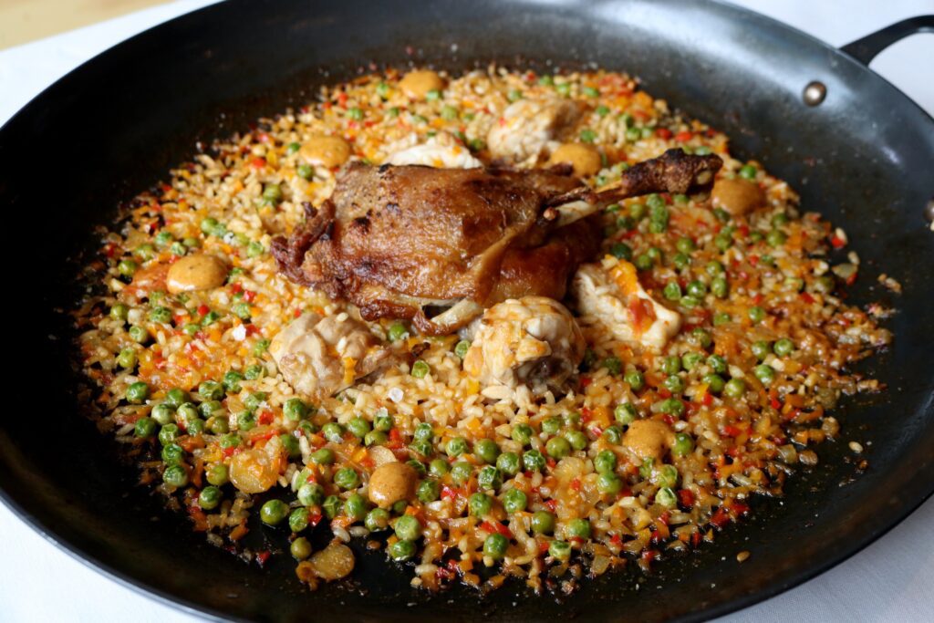 Sophia Ortega inspired her dad’s Valencia bomba rice entree, pato y Conejo. (Photo by Paula Murphy)