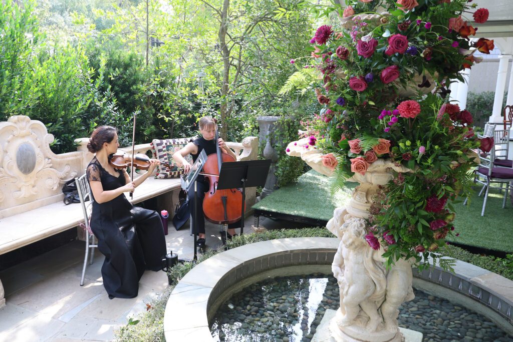 Violinists perform during the Houston Symphony garden tea party (Photo by Priscilla Dickson)