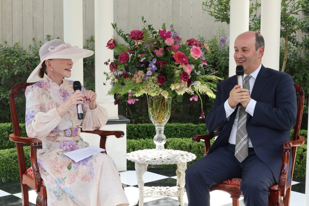 PaperCity's Shelby Hodge interviews Houston Symphony executive director and CEO Gary Ginsling at the garden tea party (Photo by Priscilla Dickson)