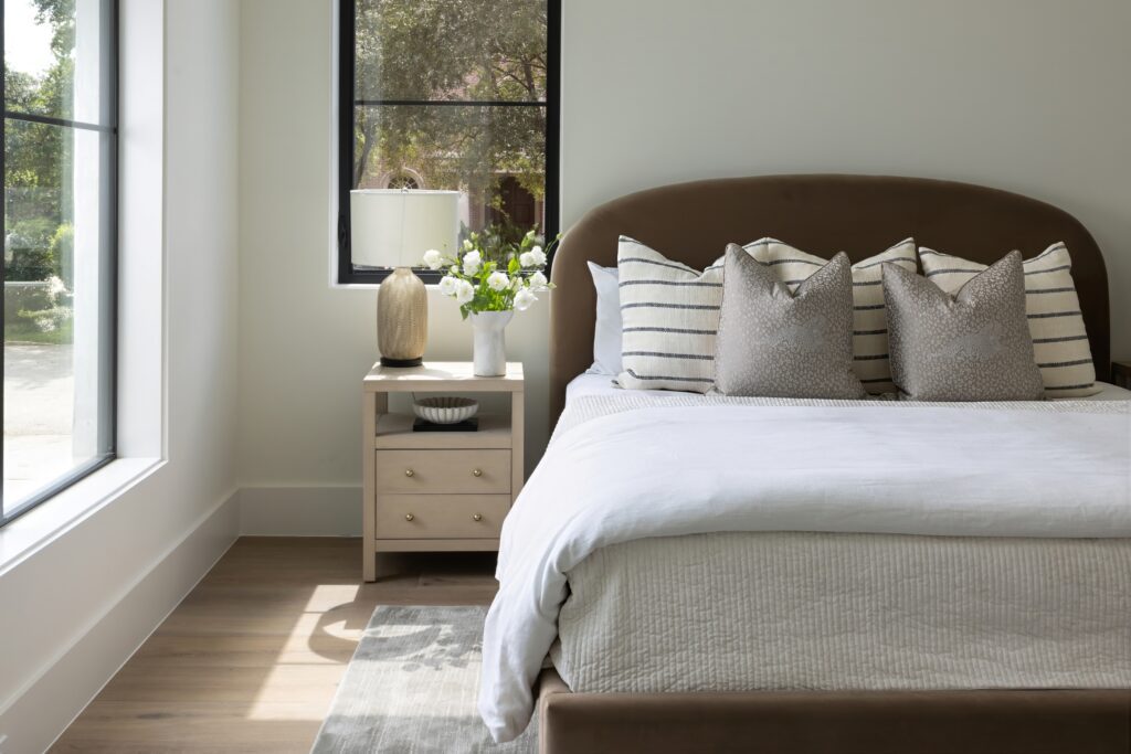 One of five bedrooms in the re-imagined home at 11606 Blalock Lane. (Photo by Laurie Perez)