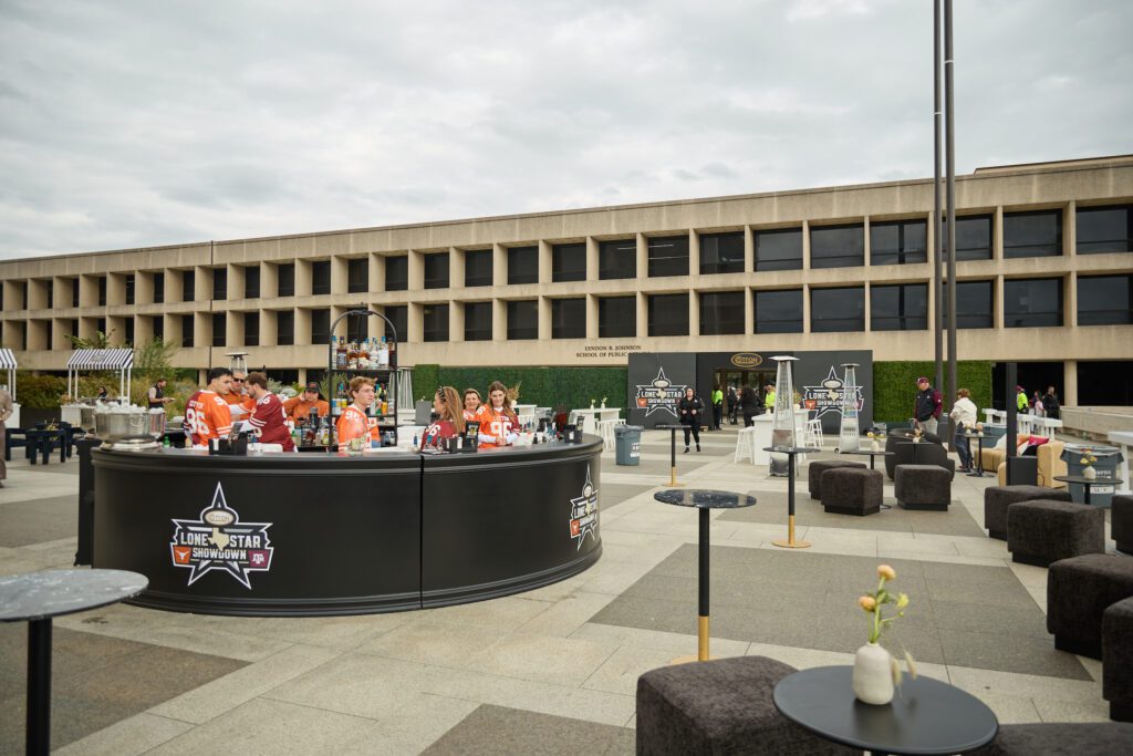 Lone Star Showdown fans of both persuasions packed the rooftop of the LBJ Presidential Library for Cotton Holdings ultimate tailgate (Photo Courtesy of Cotton Holdings) (Photo by Courtesy of Cotton Holdings)