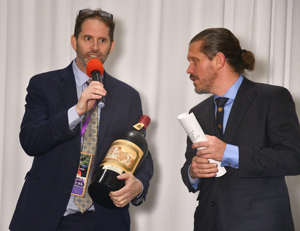 Wine chair Sean Beck, emcee Kevin Quinn of KRBE-FM at The Periwinkle Foundation Iron Sommelier competition. 