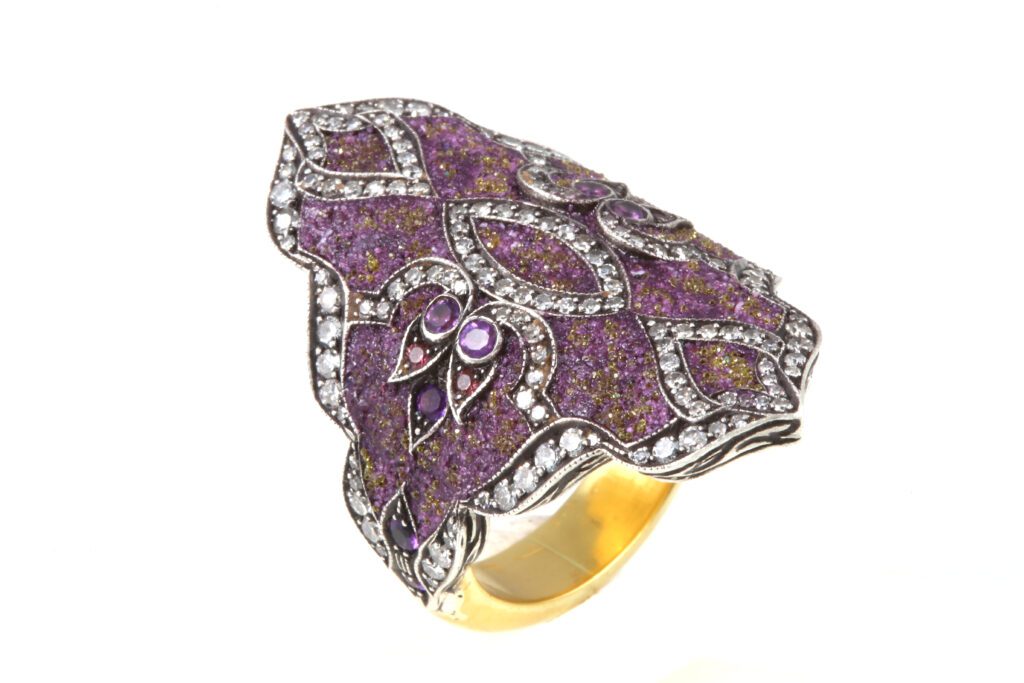 Sevan Biçakçi Mesopotamia ring with gold, silver, diamonds, sapphire, and mosaic with sugilite-diamond tesserae and amethysts, price upon request, at Stanley Korshak, Dallas; Magnolia City Jewelers, Houston; Korman Fine Jewelry, Austin; Sevan Biçakçi boutique, Miami. 
