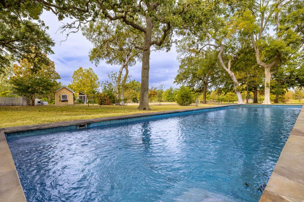 3100 Trail's End in Brenham boasts a vast swimming pool  (Photo by Courtesy of Nan & Company Properties)