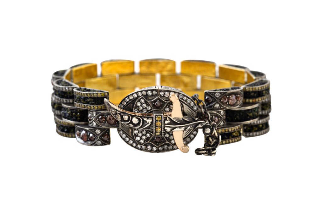 Sevan Biçakçi bracelet in gold and silver with diamond cuts and micro-mosaics of semiprecious stones and yellow diamonds; inspired by historic tank-pattern design, $47,500, at Magnolia City Jewelers; Korman Fine Jewelry, Austin; Sevan Biçakçi boutique, Miami.